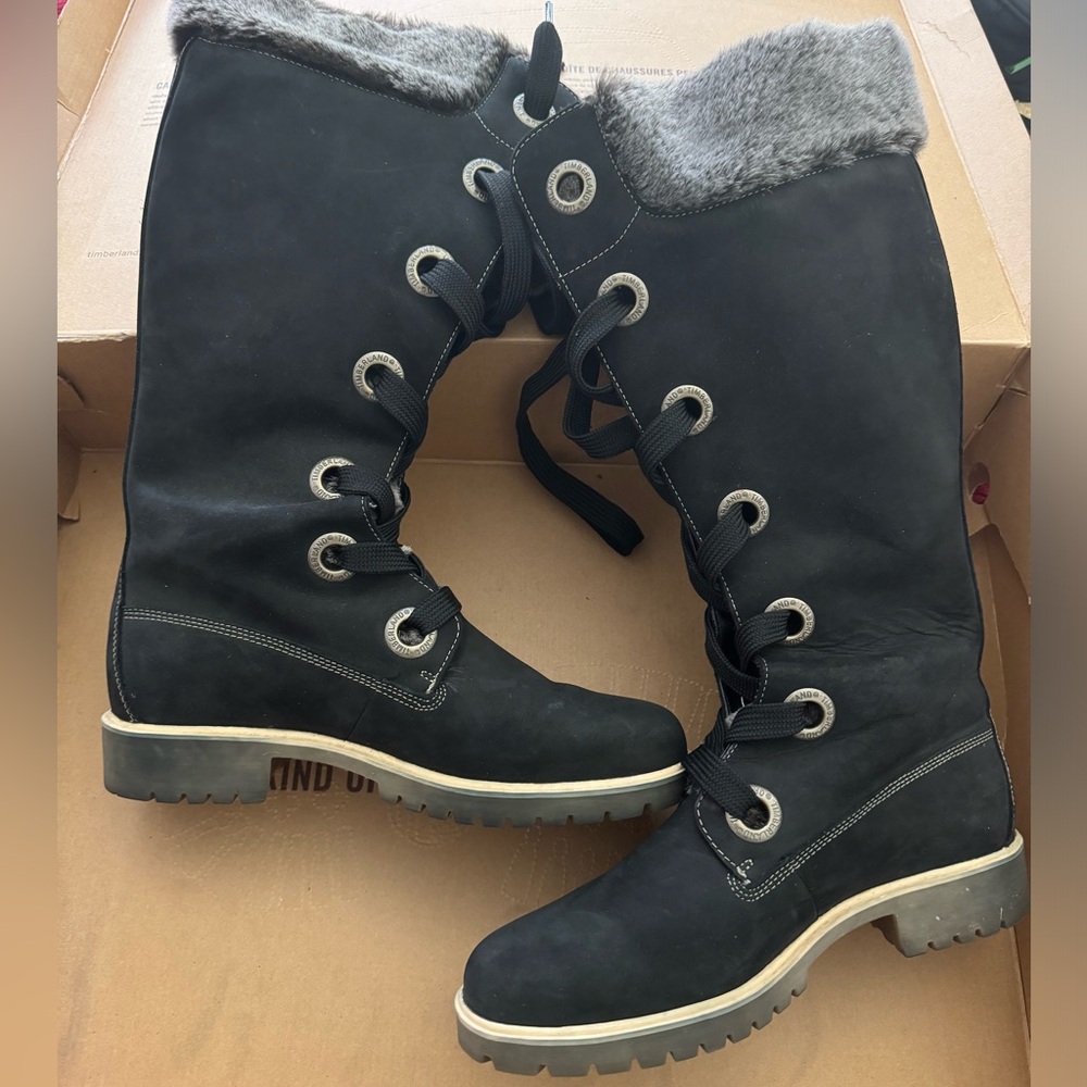 Black Timbaland boots with grey/black fur